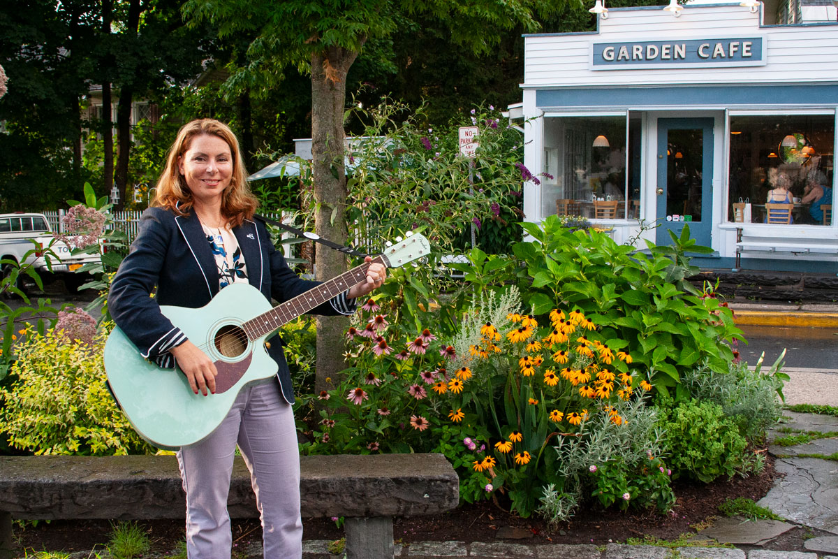 Sharon playing guitar in Woodstock NY